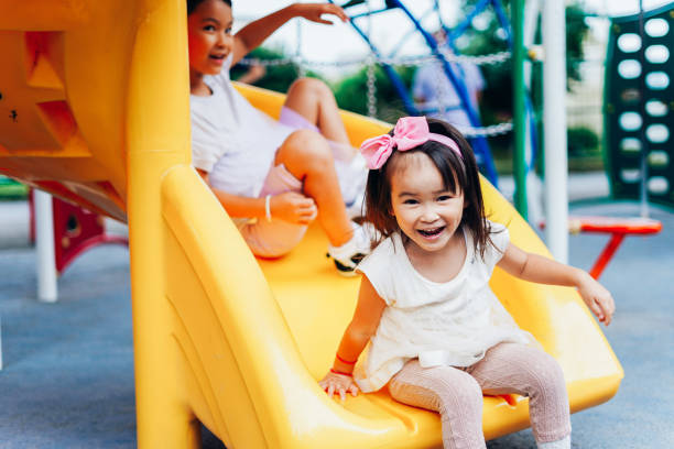 Sisters playing together in the park